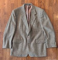 Front view of herringbone blazer with lining visible