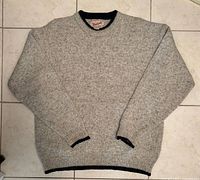Front view of grey Woolrich sweater