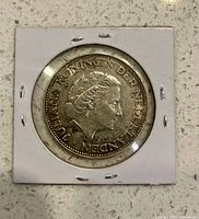 Obverse showing Queen Juliana portrait and legend in holder