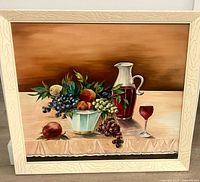 Front view of framed still life painting