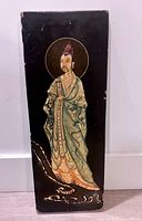 Front view of full lacquer panel showing figure and overall condition