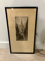 Front view of framed etching showing artwork, mat, frame