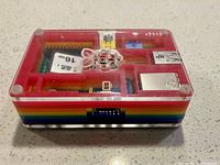 Top view of Raspberry Pi Model B in PiRoni rainbow case showing GPIO header and ports