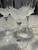 Three goblets close-up showing frosted petal motif and stem detail