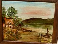 Full view of framed coastal oil painting signed Eveline Hampton, 1979