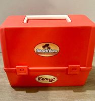 Front view closed showing Beach Bum sticker and latch