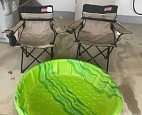 Overall lot showing two Coleman chairs and green kiddie pool