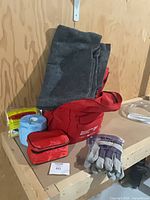 Backpack with blanket, first-aid pouch, tissue roll, emergency blanket, gloves