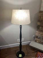 Full view of black floor lamp illuminated