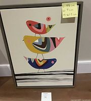 Front view of framed print showing bird design and frame
