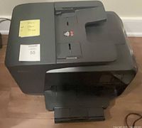 Angled view of HP OfficeJet Pro 8710 showing scanner lid and control panel