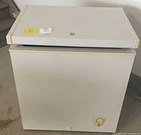 Front view of Kenmore chest freezer showing lid and body