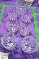Seven lead crystal tumblers arranged on table