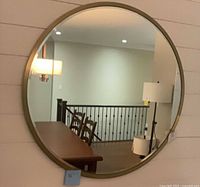 Front view of round mirror mounted on wall