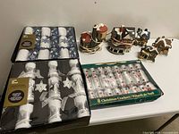 Overview of all items: three boxes of crackers and six ceramic houses