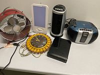 All six electronics arranged on table