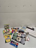 Full lot overview showing paper rolls, stamp pads, markers, pens and clay