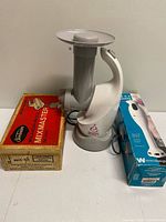 All three appliances with their boxes and cords visible