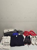 Overview of all clothing, shoes and hats laid out