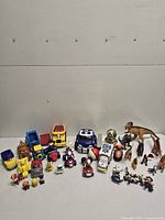Full contents of lot: vehicles, figures, dinosaurs, robots
