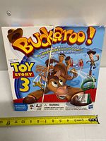 Front of Toy Story 3 Buckaroo! game box with branding and visible tear