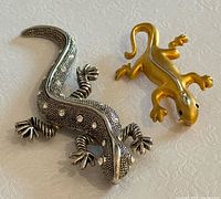 Front view of both brooches