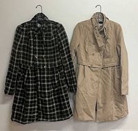 Front view of both coats hanging