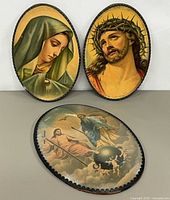 Front view showing all three oval plaques