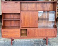 Front view of teak highboard showing overall design and compartments