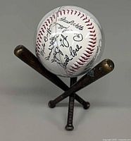autographed baseball on tripod bat stand frontal view
