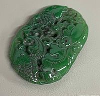 Front view showing carved koi and scrollwork