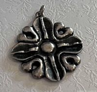 Front view of sterling silver pendant showing design details and bail