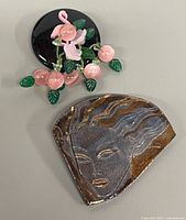 Front view of both brooches