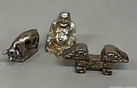 Front view of Buddha, pig figurine and chopstick rest