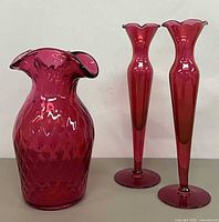 Group showing ruffled vase and two bud vases