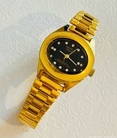 Front view showing case, dial, bracelet