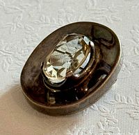 Side perspective highlighting stone height and silver setting