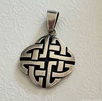 Front of sterling silver Celtic knot pendant showing design