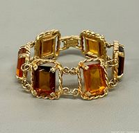 Front view showing stones and openwork frames