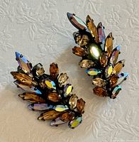 Front view of both rhinestone earrings showing color and layout