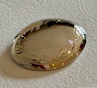 Front view showing engraved design