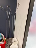 four brushed metal reading lamps and table lamps bases visible