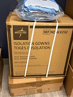 Medline Isolation Gowns case and additional sealed Level 2 gowns box visible