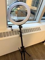 LED ring light on tripod stand with phone holder