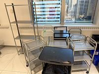 overall view showing carts and metal shelving rack