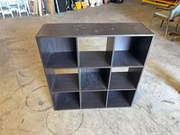 Front view showing six open cubbies and overall wear