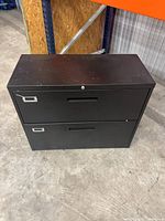 Front view showing two drawers, lock and overall condition