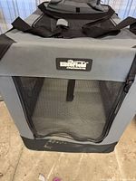 Front view showing EliteField logo, mesh door, gray canvas