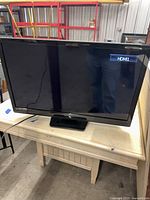 Front view of Emerson TV powered on displaying HDMI input