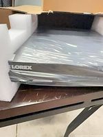 Factory-wrapped Lorex DVR inside foam protection
